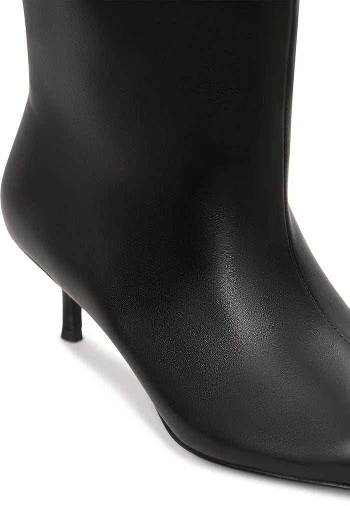 A stylish pair of black women's ankle boots with a kitten heel, known as Regina boots.