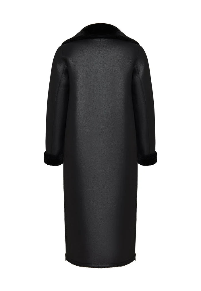 A stylish black shearling coat, perfect for winter days. This faux shearling jacket is reversible and trendy outerwear for women.