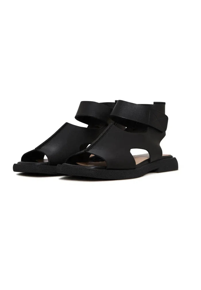 A fashionable pair of black leather ankle strap sandals, the perfect combination of style and sophistication.