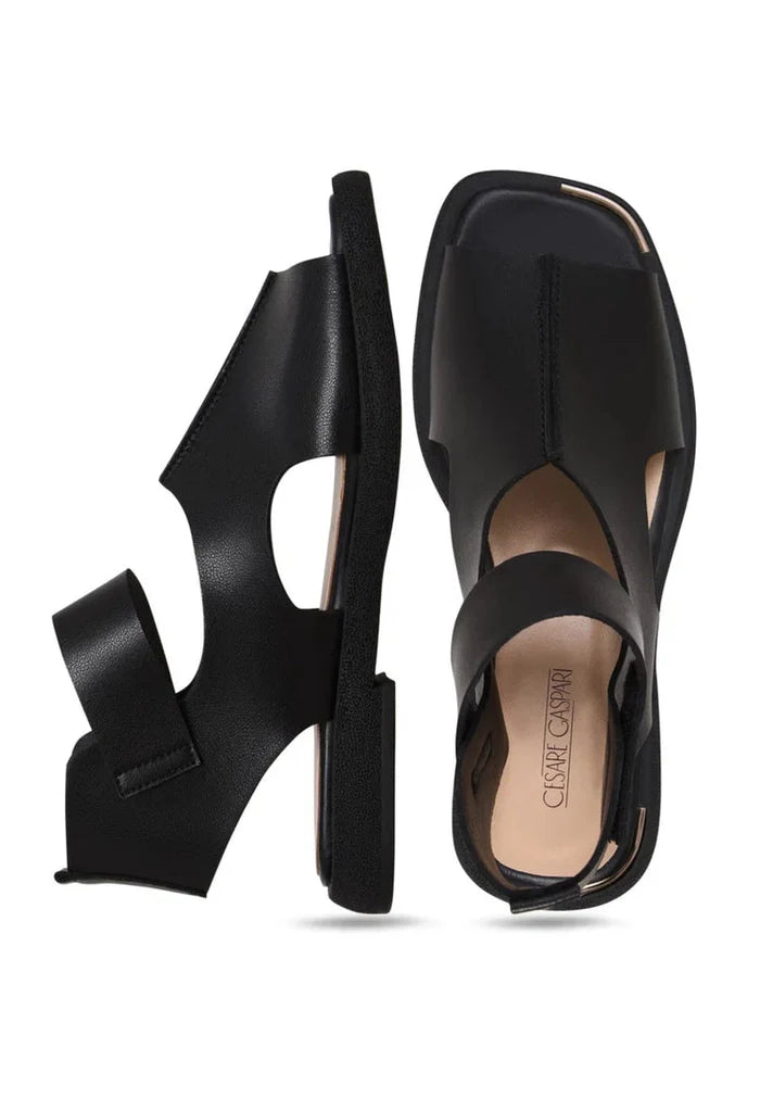 Stylish black leather ankle strap sandals, perfect for any occasion.