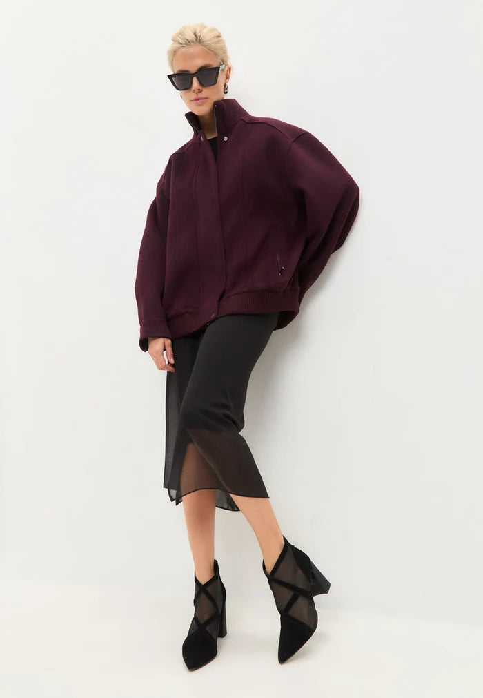 A trendy pair of women's black sheer ankle boots with a mesh design, perfect for fashion-forward looks.