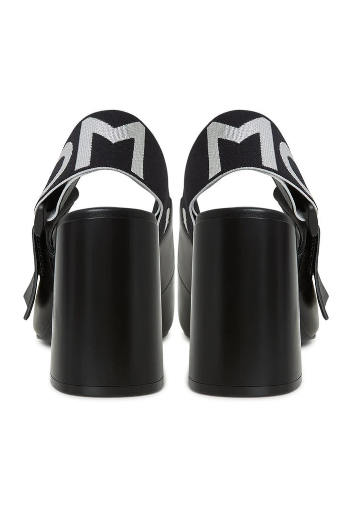 A trendy pair of black Jimena block heeled slingback pumps, the perfect addition to any women's footwear collection.