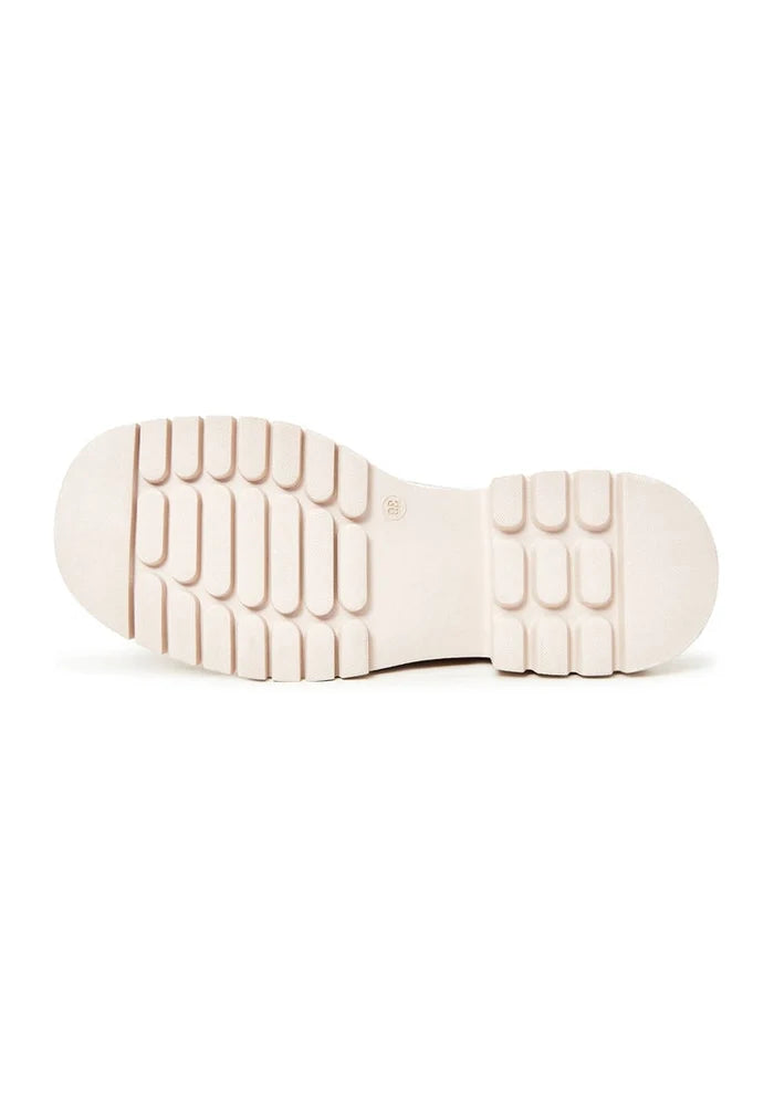 A stylish pair of beige block heels loafers for women, offering both fashion-forward design and comfortable wear.