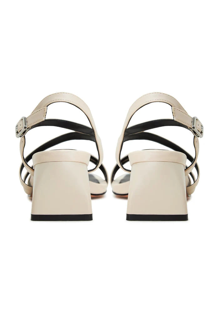 A chic pair of beige block heels sandals, known as Maria sandals, for women's fashion footwear.