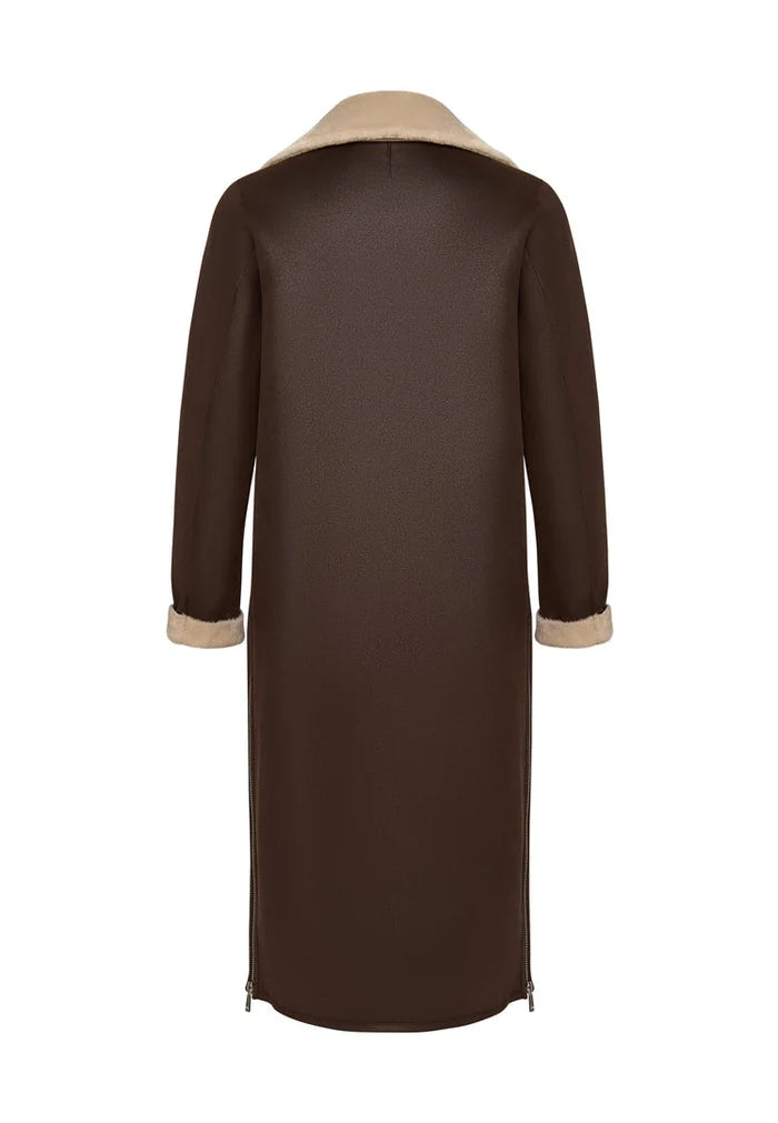 A stylish brown faux fur coat that can be reversed to a cozy shearling jacket - a must-have long shearling jacket for women looking for versatile outerwear options.