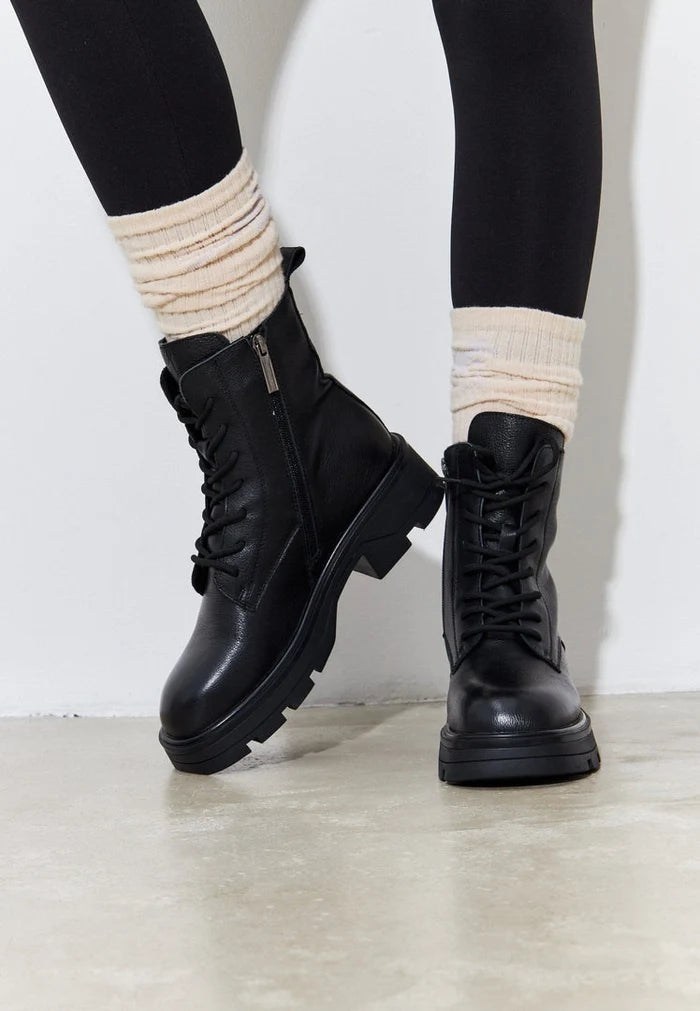 A pair of stylish black lace-up ankle boots for women, perfect for a casual and trendy look.