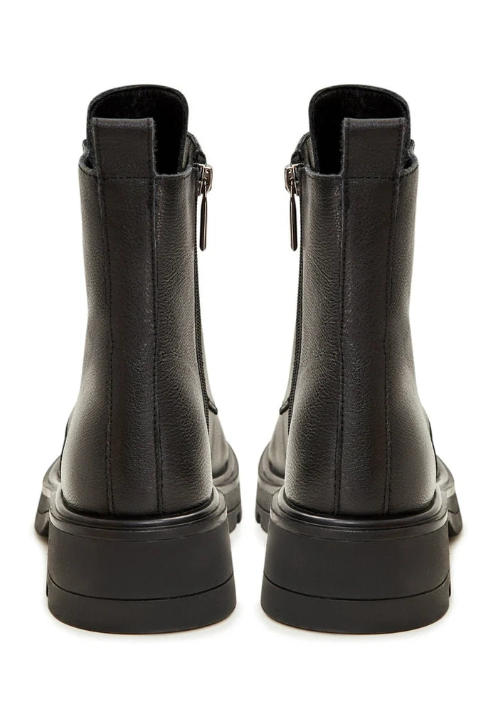A pair of stylish black lace-up ankle boots for women, perfect for a casual and trendy look.