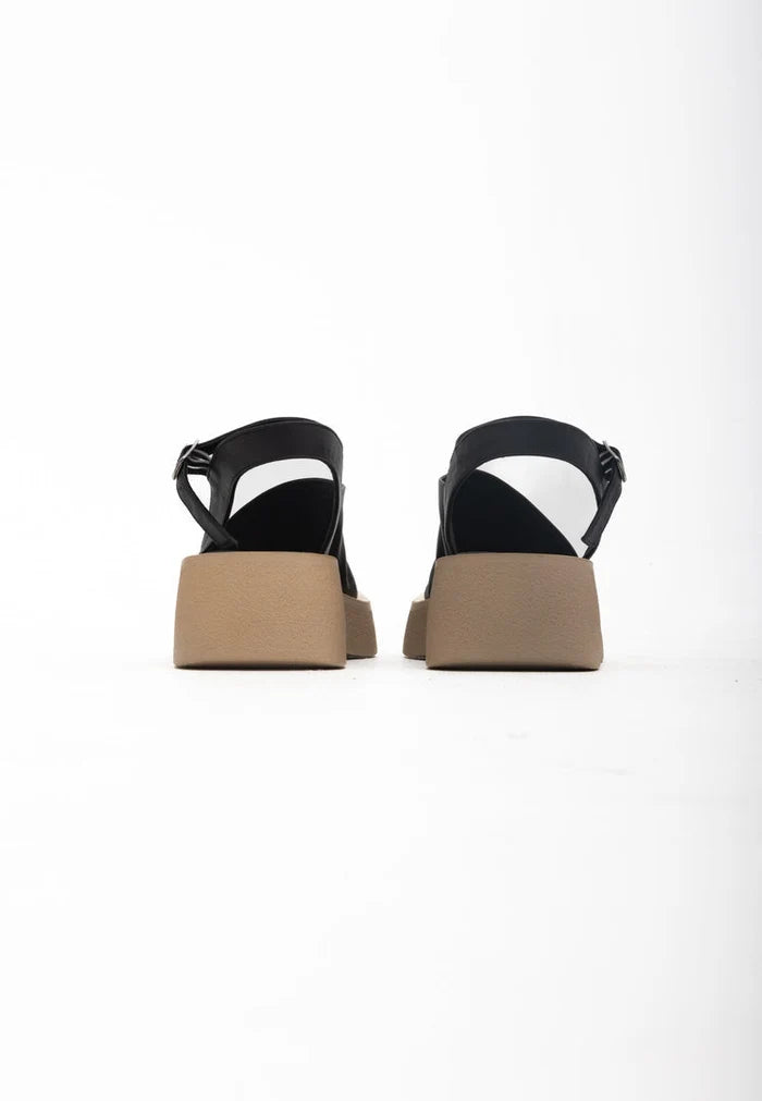 A stylish pair of black women's platform sandals, perfect for casual wear, offering both comfort and style.