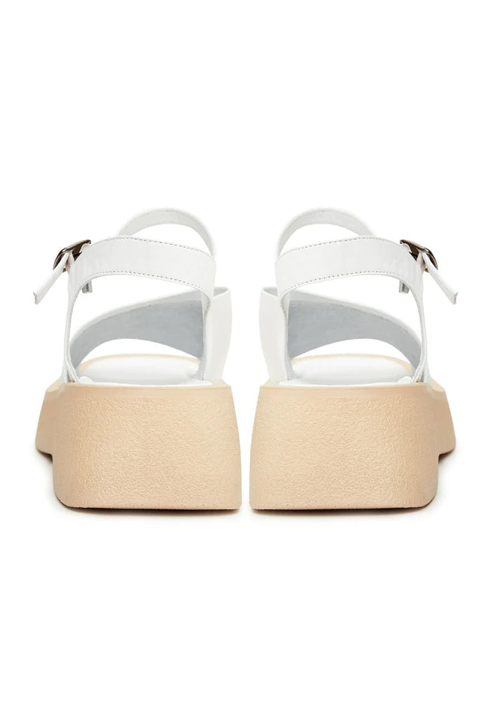 A pair of stylish and comfortable white casual platform sandals, the best white platform sandals for any summer outfit.