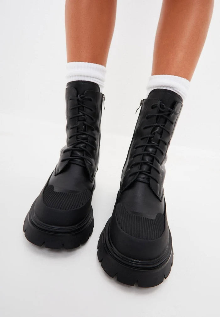 A chic pair of black suede lace-up ankle boots, perfect for casual wear.