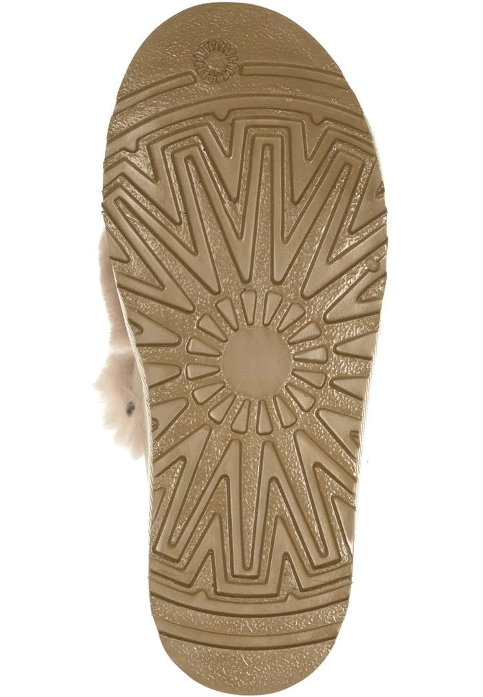 A fashionable pair of beige chain fur lined loafers, perfect for women who appreciate designer footwear.