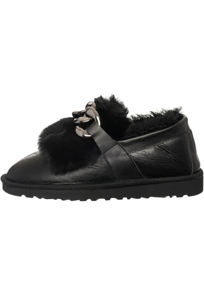 A pair of stylish black fur-lined loafers with chain detail, perfect for women's winter footwear.