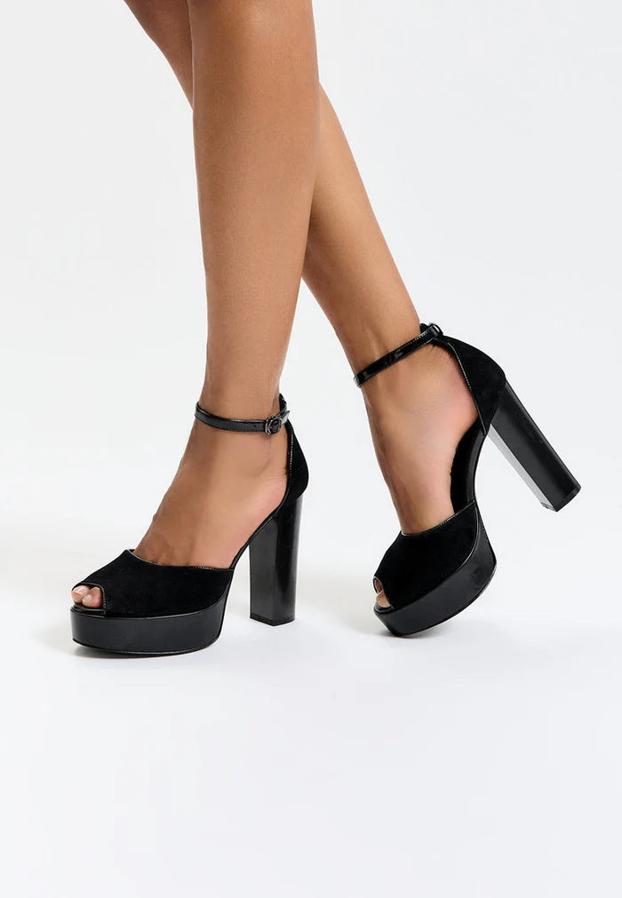 A stylish pair of women's black block heel pumps, perfect for any fashionable outfit.