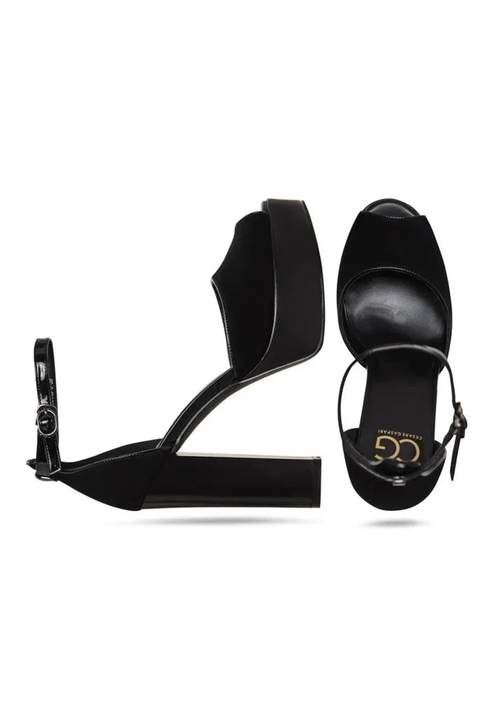 A stylish pair of women's black block heel pumps, the epitome of fashionable footwear.