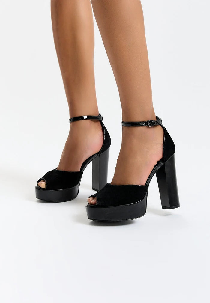 A stylish pair of women's black block heel pumps, perfect for any fashionable outfit.