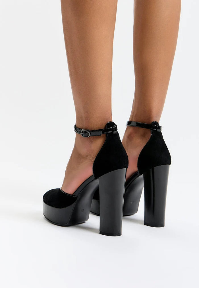 A stylish pair of black block heel pumps, ideal for the fashion-forward woman looking for elegant and comfortable Women's block heel shoes.