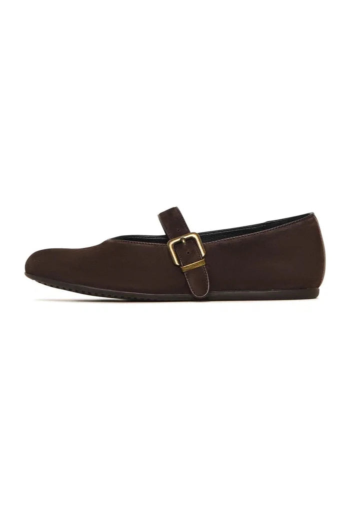 A stylish pair of brown Mary Jane flats, perfect for fashion-forward women seeking chic and comfortable footwear.