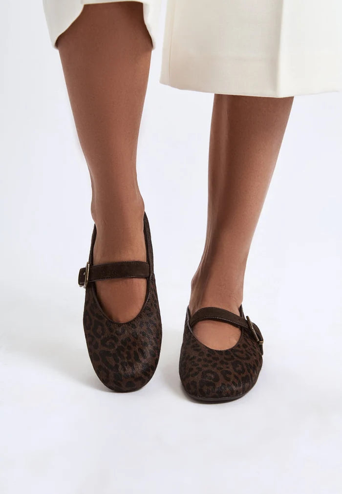 A close-up image of stylish leopard flats, featuring chic Mary Jane design and trendy animal print, perfect for fashionable women's footwear.