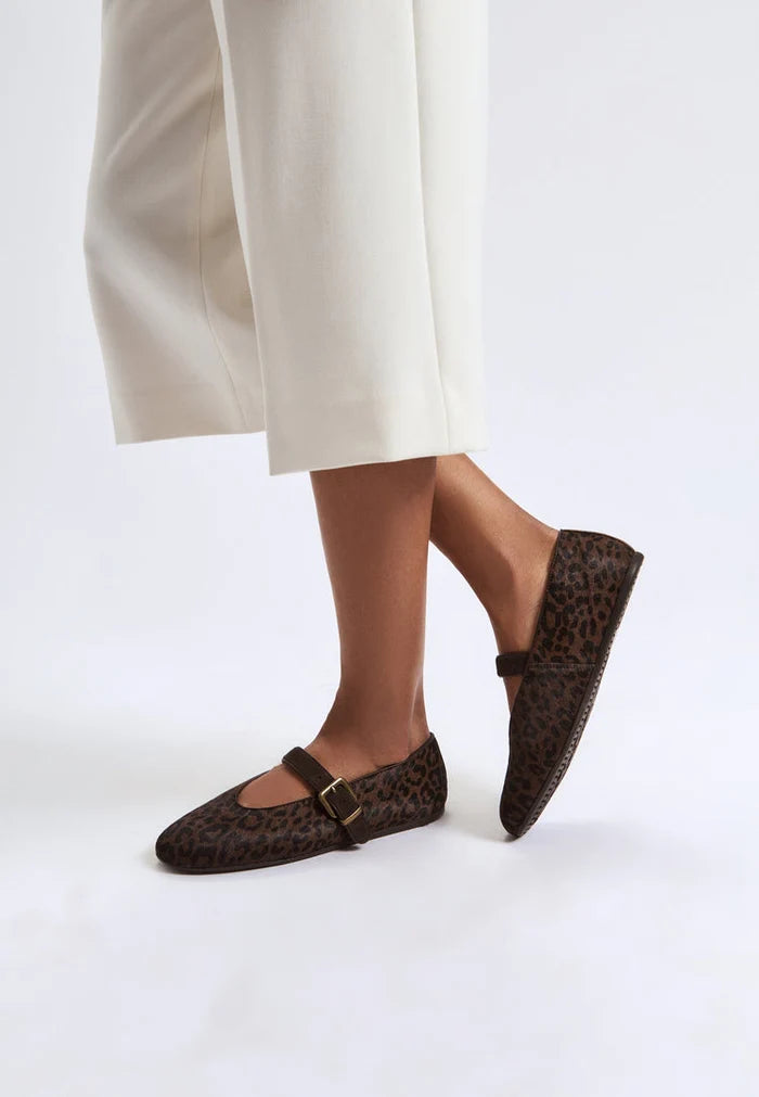 A pair of stylish women's leopard flats shoes, chic Mary Jane design featuring trendy animal print footwears.