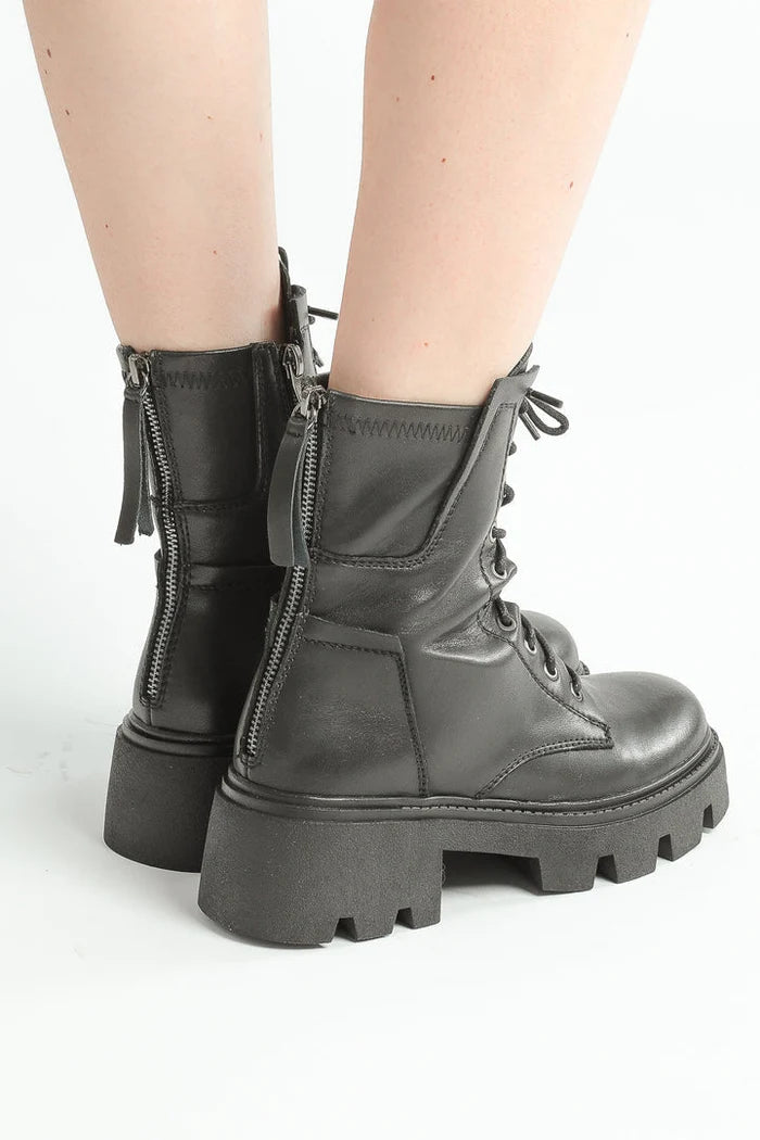 A stylish pair of chunky leather lace-up combat boots for a trendy and edgy look.