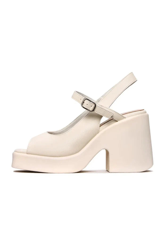A stylish pair of chunky white platform sandals with a trendy design, perfect for women looking for fashionable chunky heel sandals.