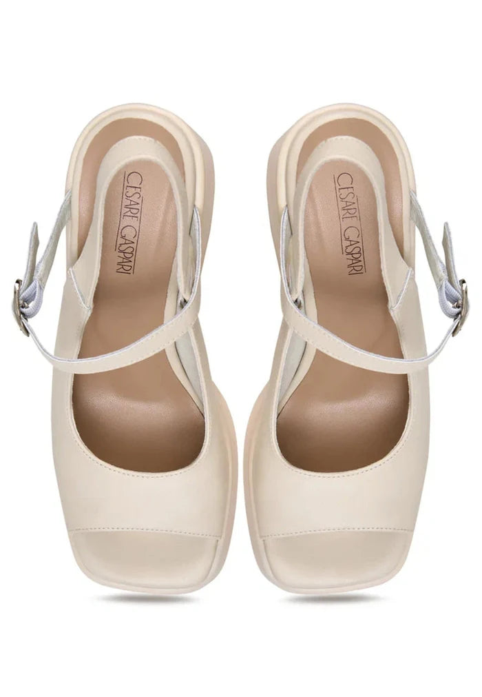 A pair of trendy chunky white platform sandals for women with a stylish chunky heel design.