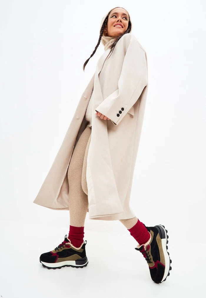 A pair of trendy and fashionable brown chunky platform sneakers for women, perfect for adding height and style to any outfit.