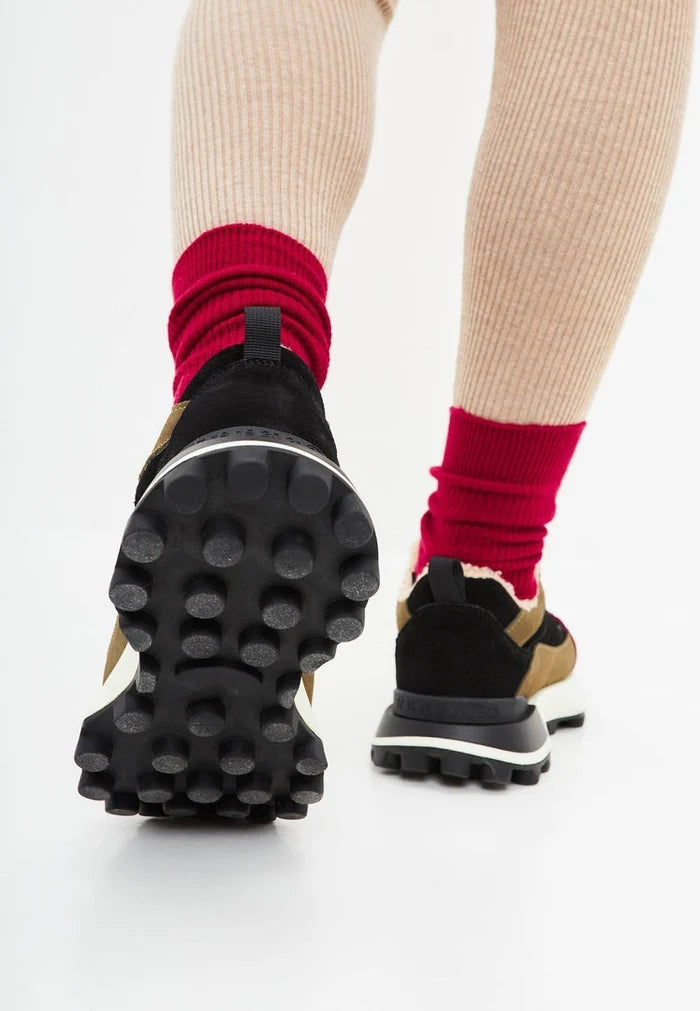 A pair of trendy brown chunky platform sneakers, perfect for fashion-forward women looking for stylish and comfortable footwear.