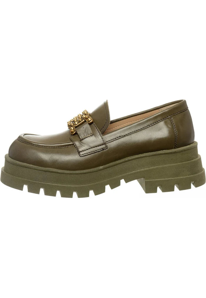 A pair of stylish studded and chunky dark green loafers, the perfect fashion footwear for women.