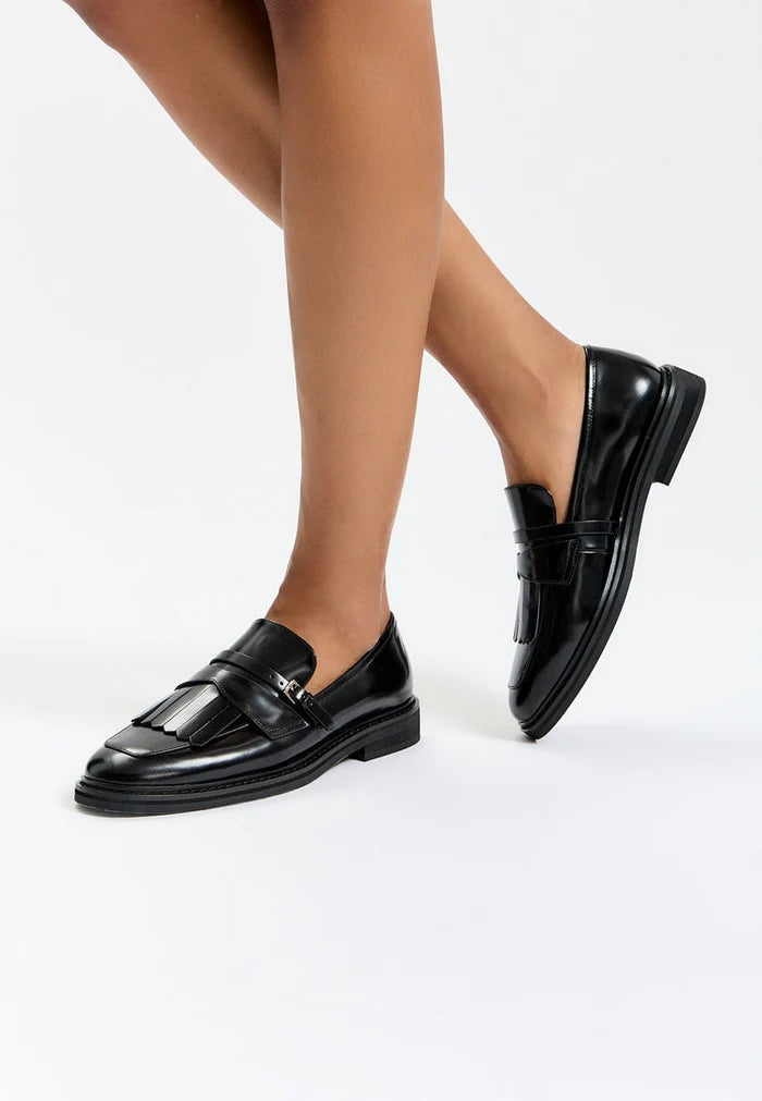A stylish pair of classic fringe loafers, perfect for adding a touch of vintage charm to any outfit.