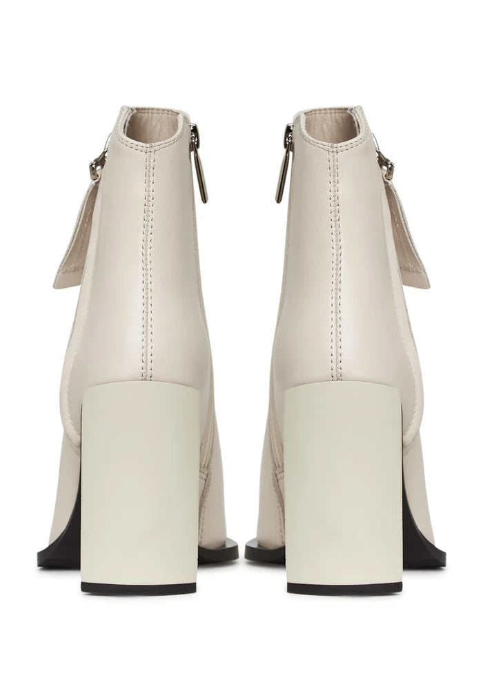 A stylish pair of designer leather ankle boots in classic beige, perfect for women's fashion footwear.