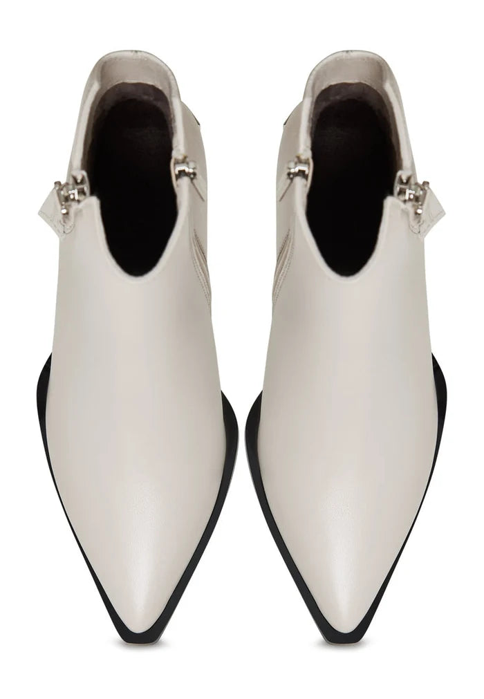 A pair of chic designer leather ankle boots in classic beige, the essential fashion boots for women's footwear.