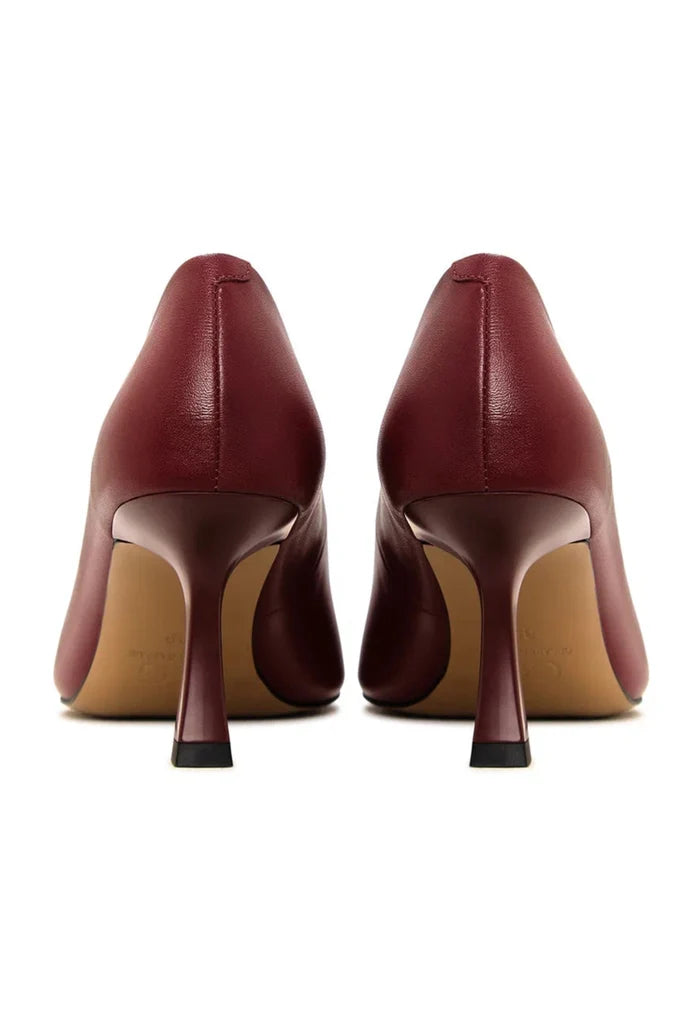 A pair of elegant Bordeaux leather pumps, classic designer heels perfect for any occasion.