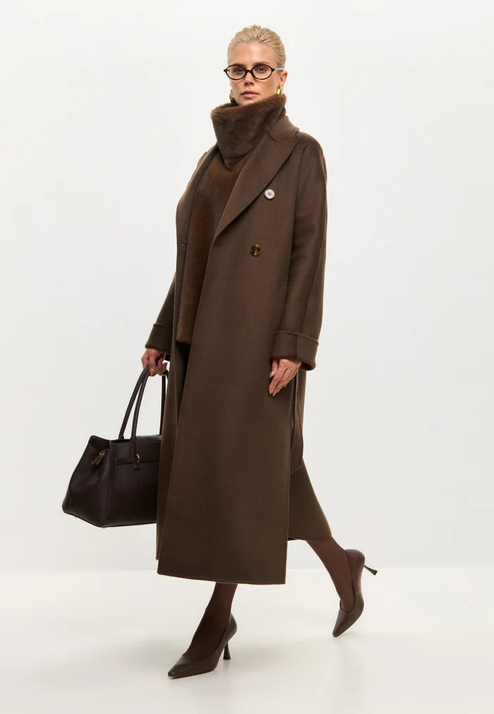 A stylish pair of dark brown leather pumps, a classic choice in women's footwear for a fashion-forward look.