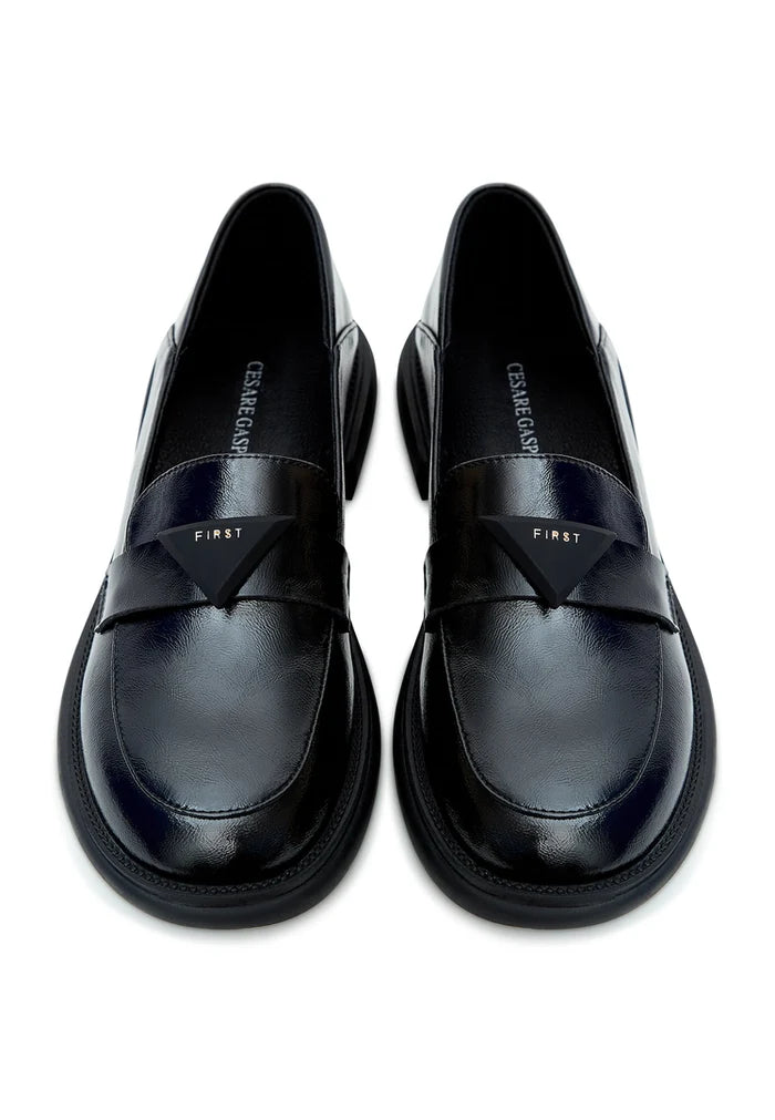 A sophisticated pair of black slip-on loafers - a must-have in every man's wardrobe for a classic and timeless look.