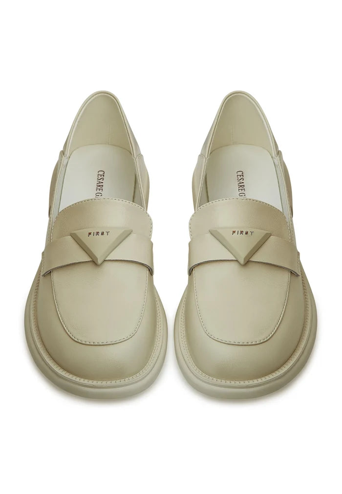 A stylish pair of slip-on white loafers, the perfect classic shoes for any outfit.