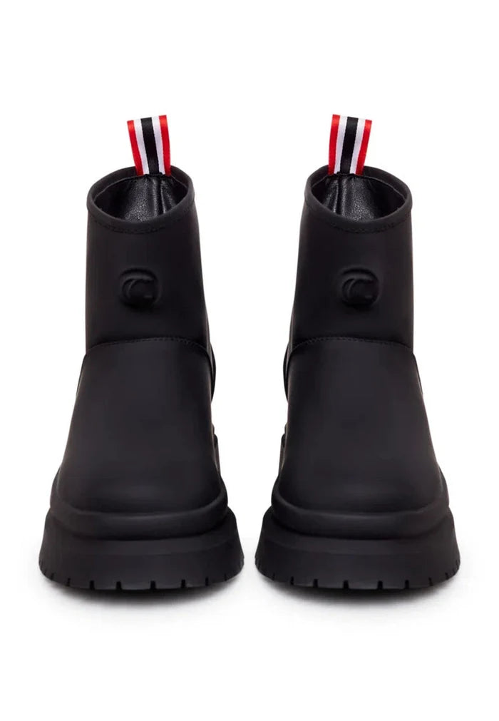 A pair of classic black pull-on winter boots, perfect for the cold season and stylish winter footwear.