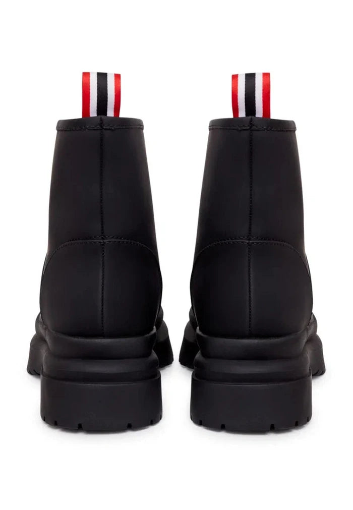 A pair of classic black pull-on winter boots, perfect for cold weather, as essential winter footwear.