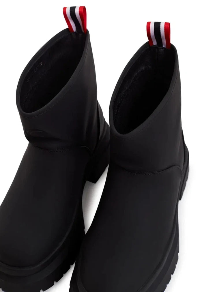 A pair of stylish pull-on black winter boots, the perfect classic footwear for the season.