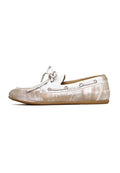 Vintage leather loafers in distressed white, a pair of classic leather shoes with a worn-effect finish, ideal for those seeking antique white footwear.