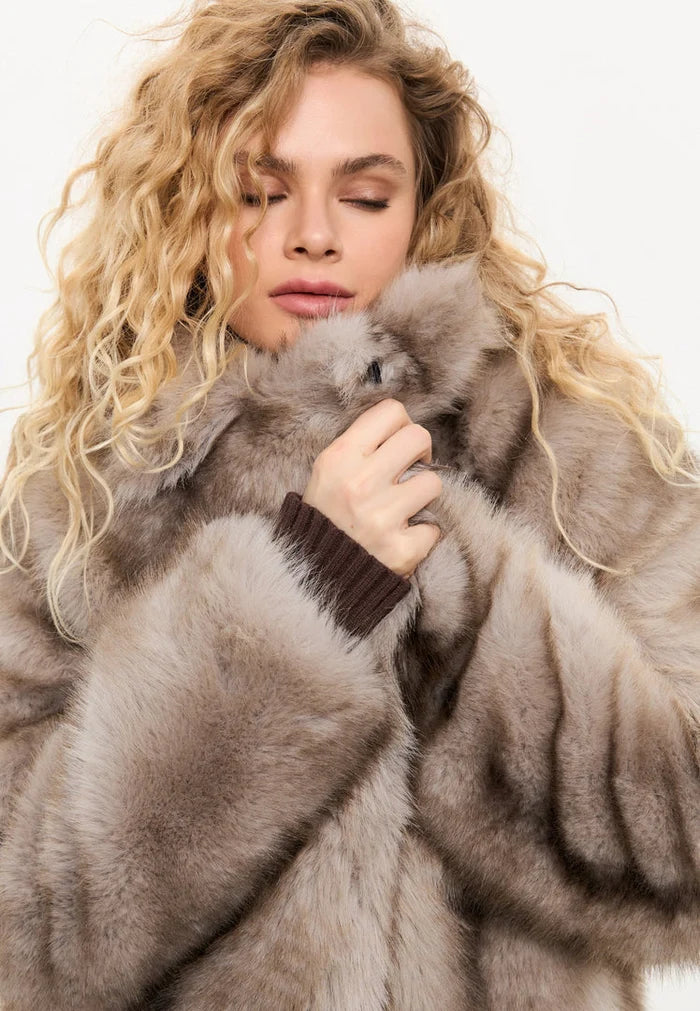 A stylish and luxurious faux fur brown coat, perfect for winter outerwear and women's fashion.