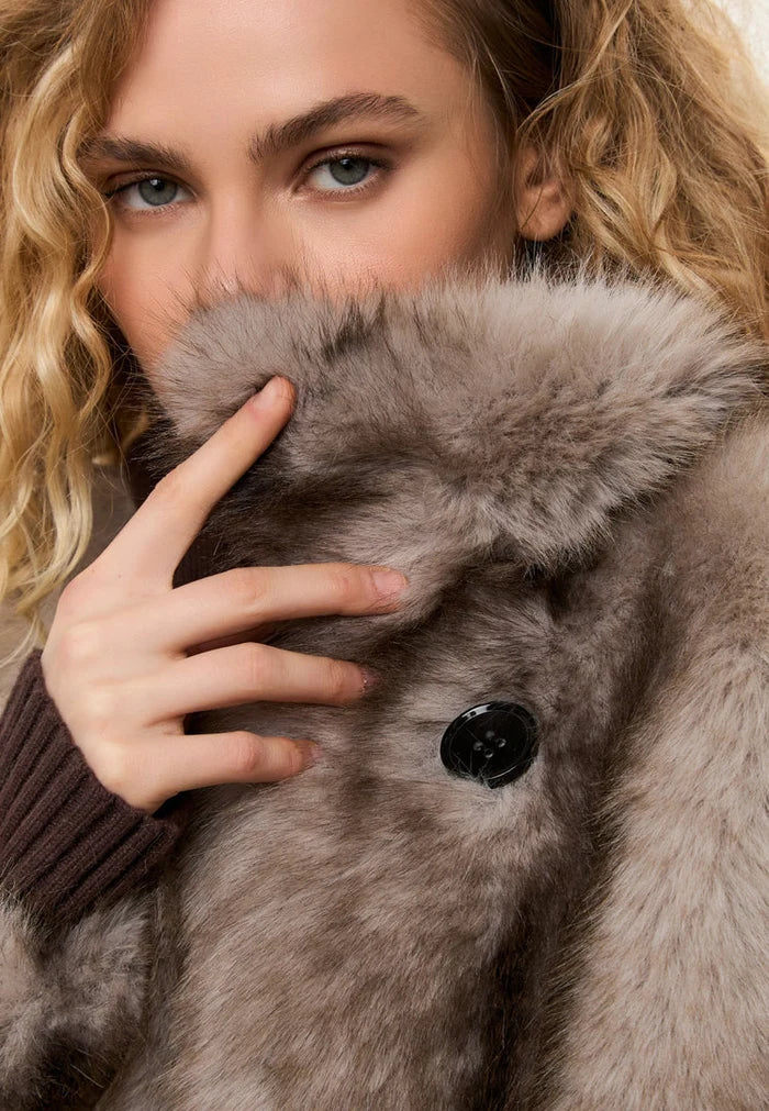 A stylish faux fur coat in brown, perfect for winter outerwear in women's fashion, adding a touch of luxury to your wardrobe.