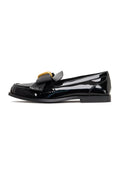 A pair of elegant black patent loafers with a stunning gold bow detail, inspired by Dorothy's iconic shoes, perfect for women's fashion.