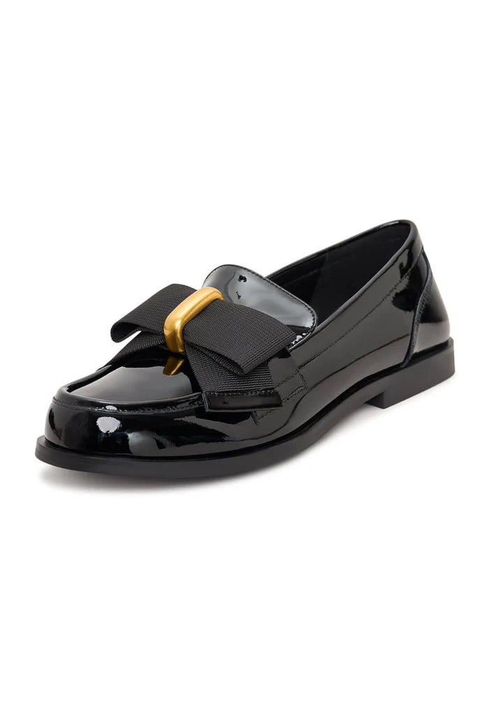 Elegant patent black women's shoes with a gold bow inspired by Dorothy's style.