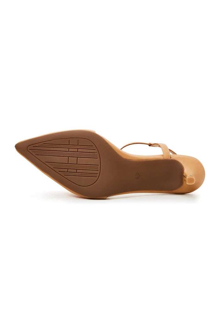 A stylish pair of elegant beige pumps, designer heels, and fashionable stilettos - the epitome of luxe shoes.