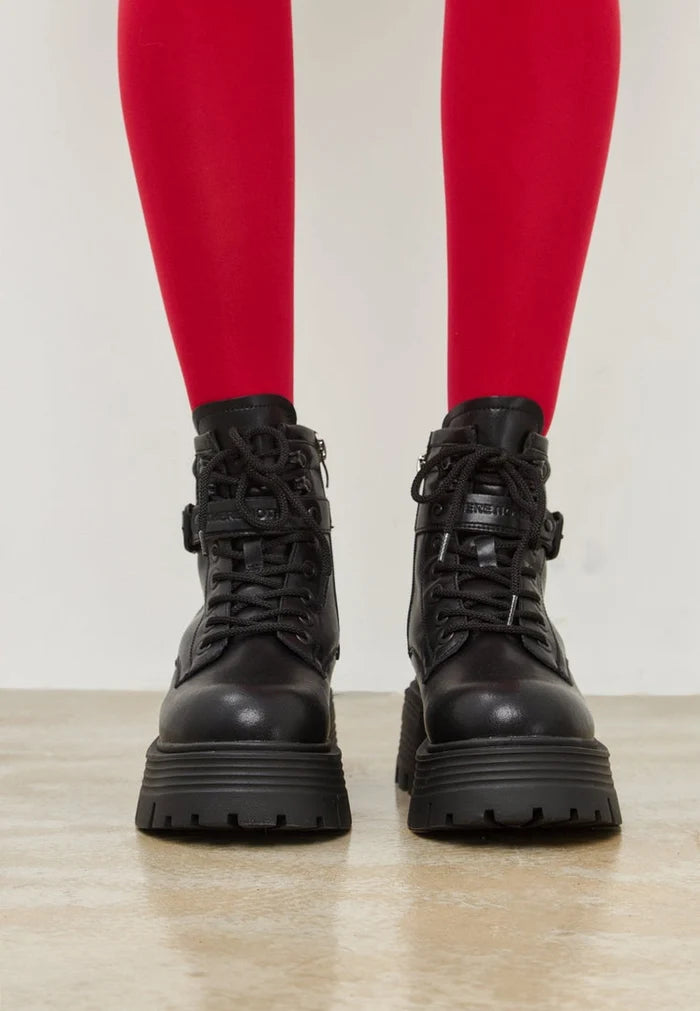 A trendy pair of black ankle boots with an elegant platform design, perfect for stylish women's footwear fashion.