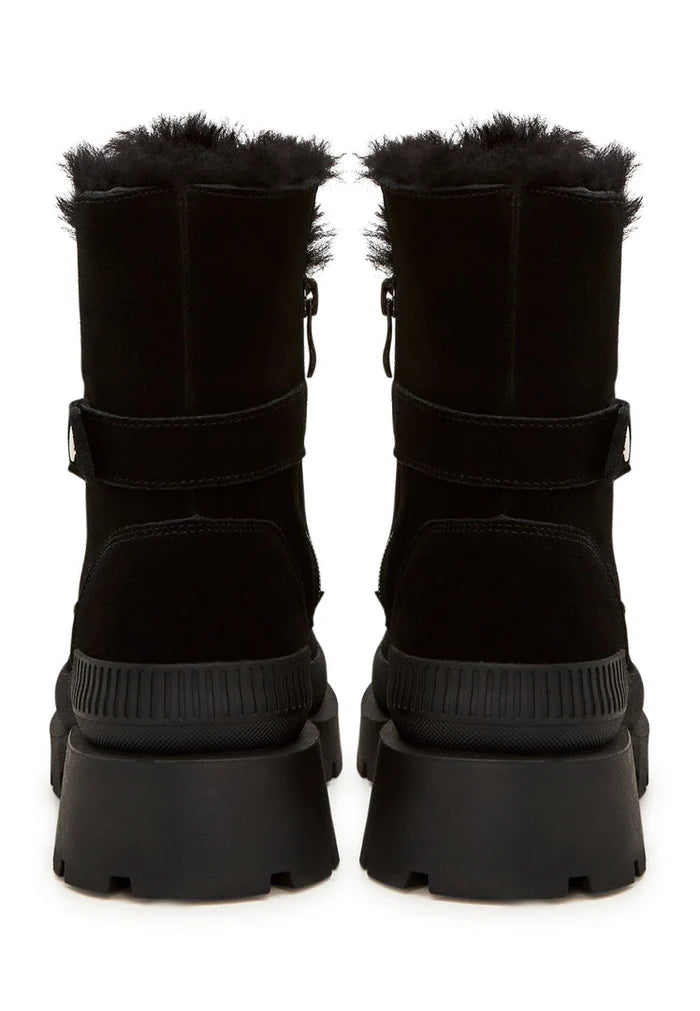 A pair of elegant black suede ankle boots, the perfect stylish and sophisticated footwear choice.
