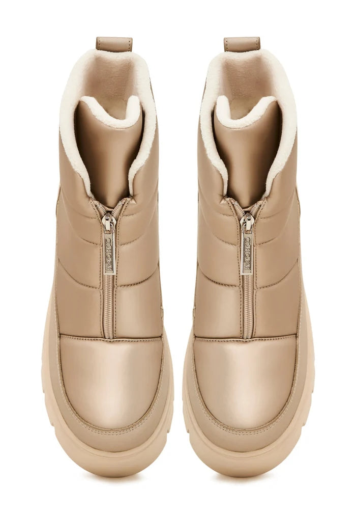 A pair of stylish beige winter boots, perfect for snowy weather and adding an elegant touch to your winter outfits.