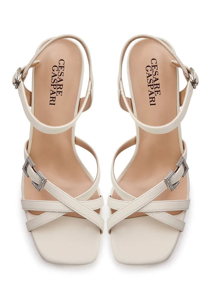 A stylish pair of beige sandals, perfect for elevating your summer footwear game. These trendy women's sandals are a must-have for the season.
