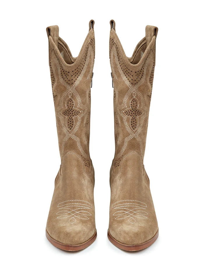 A pair of handcrafted, unique cowboy boots in light brown color, featuring intricate embroidery, a quintessential Western style footwear.